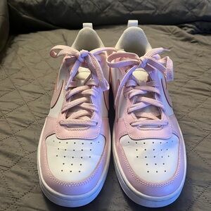 Pink and white Nikes